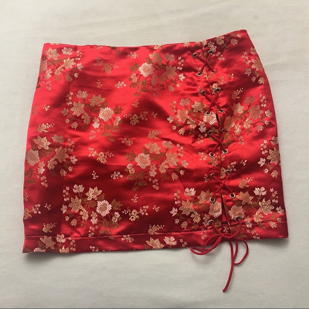 Red embroidered satin skirt